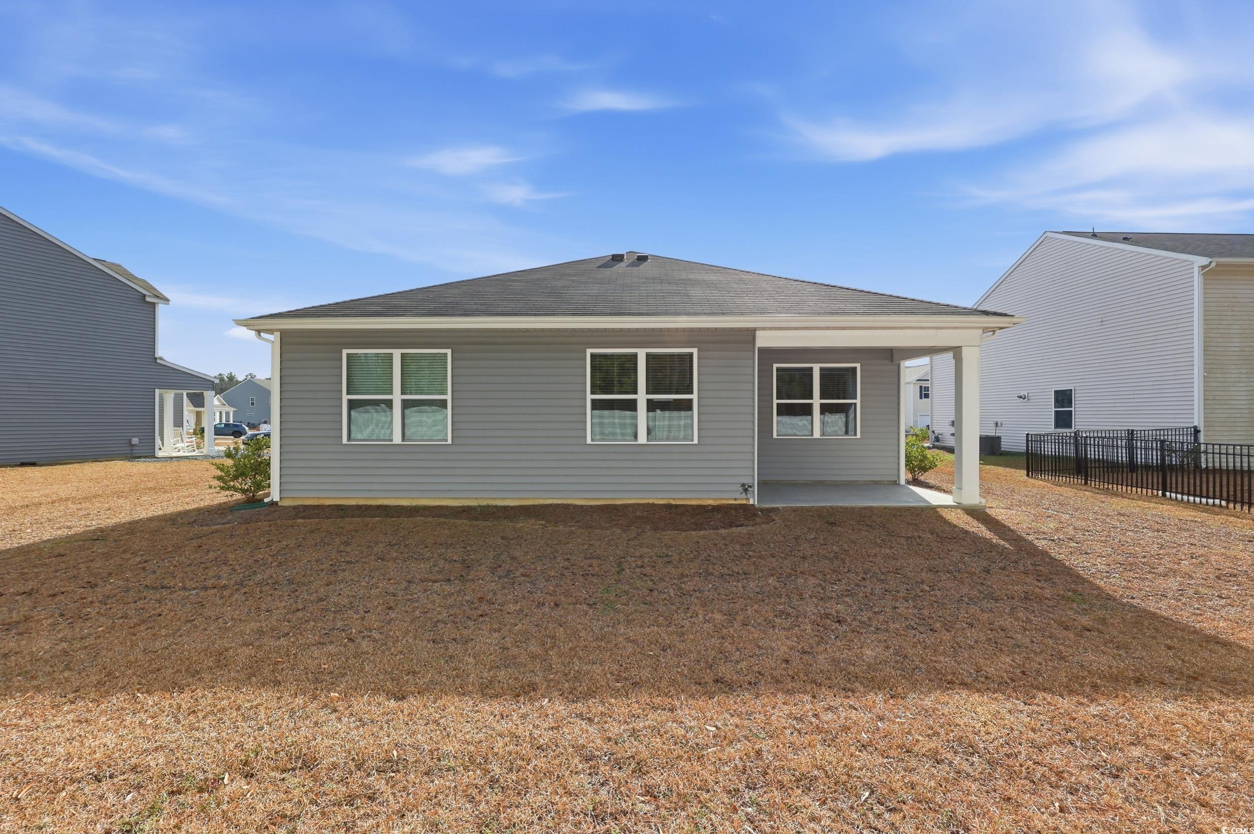 270 Columbus Street Conway, SC 29526 - Photo 27 of 38 Back of house with a patio and roof with shingles
