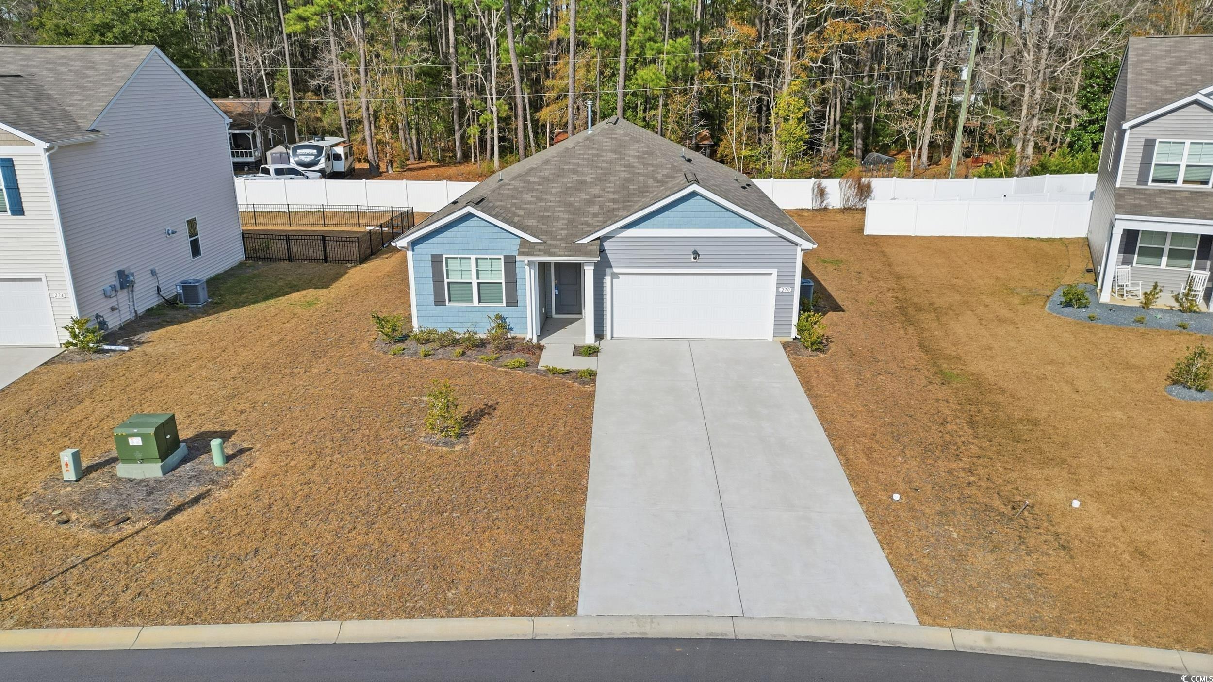 270 Columbus Street Conway, SC 29526 - Photo 29 of 38 Traditional-style house with concrete driveway, a shingled roof, and a garage