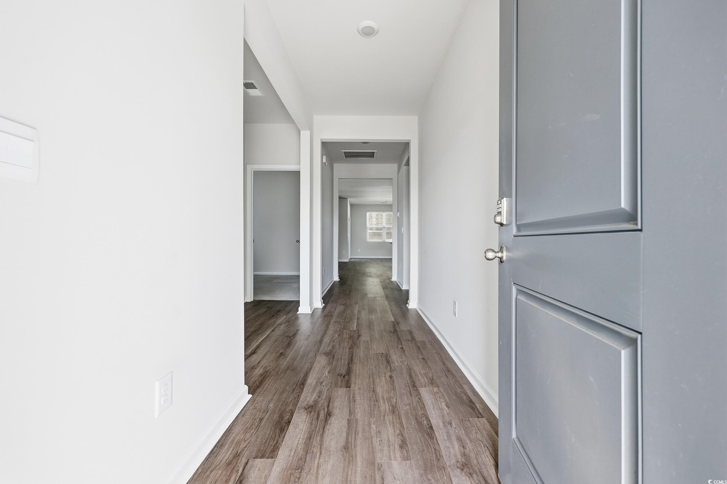 270 Columbus Street Conway, SC 29526 - Photo 8 of 38 Corridor featuring dark wood-style flooring and baseboards