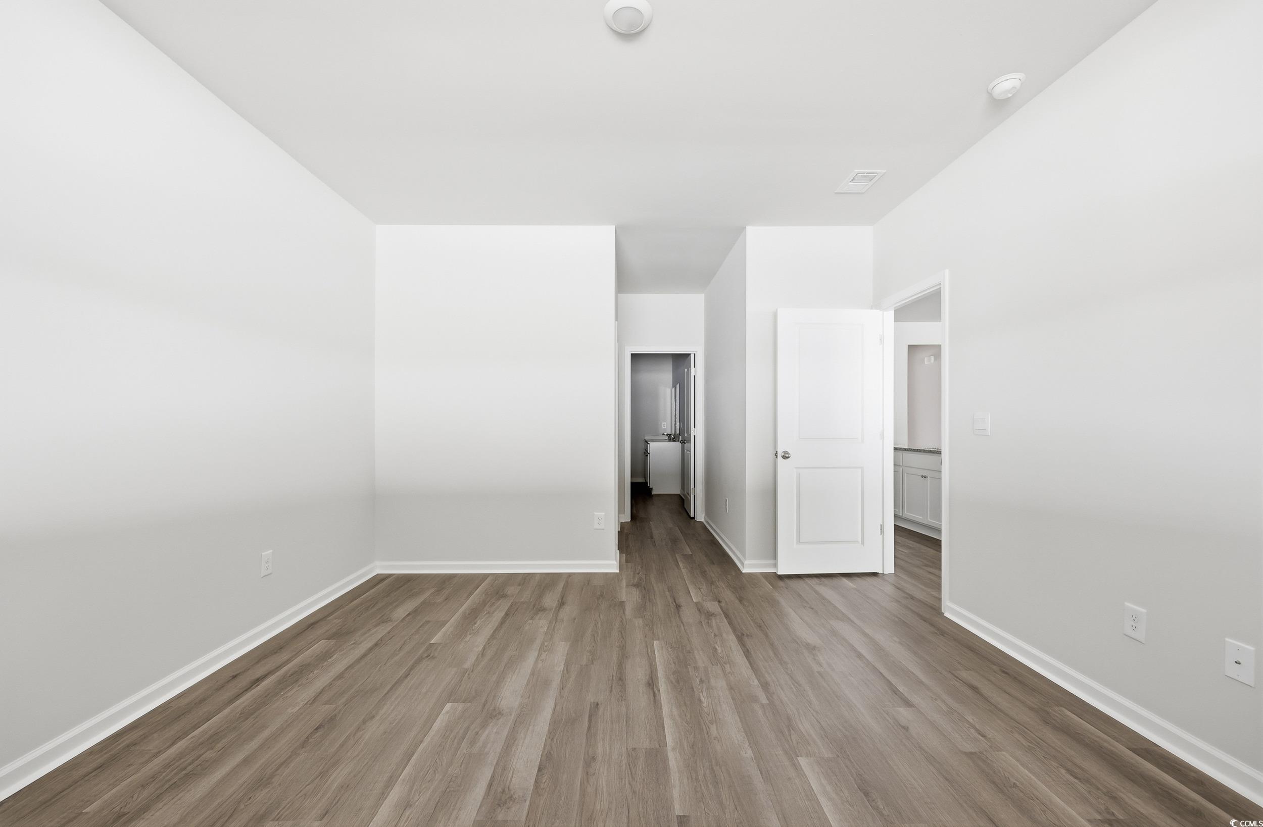 270 Columbus Street Conway, SC 29526 - Photo 9 of 38 Unfurnished bedroom featuring wood finished floors and baseboards