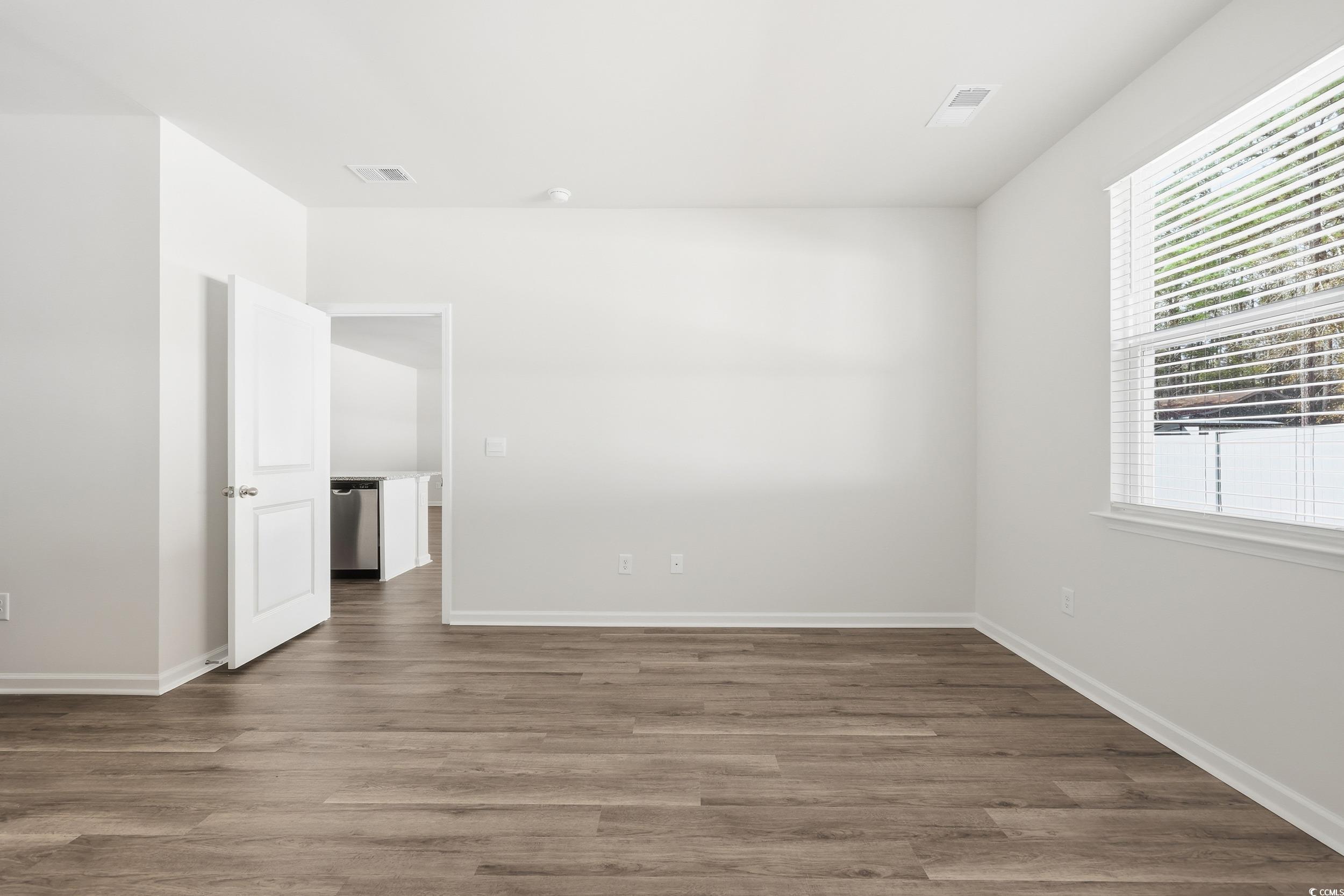 270 Columbus Street Conway, SC 29526 - Photo 10 of 38 Spare room with dark wood-style flooring and baseboards