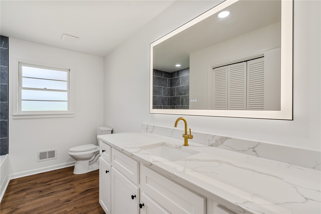 300 Vandiver Road Anderson, SC 29621 - Photo 18 of 30 Elegant primary bath with crisp white vanity and a luminous, generously sized mirror.