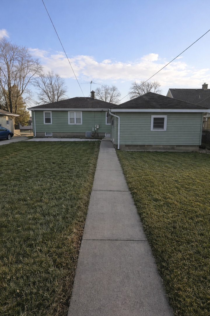 3522 Washington Street Lansing, IL 60438 - Photo 11 of 12 a pathway of a house with a yard
