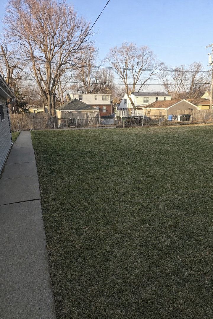 3522 Washington Street Lansing, IL 60438 - Photo 12 of 12 a view of a field of grass and trees