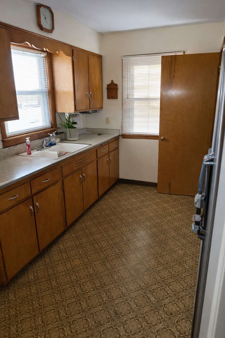 3522 Washington Street Lansing, IL 60438 - Photo 4 of 12 a bathroom with a double vanity sink a mirror and a bathtub