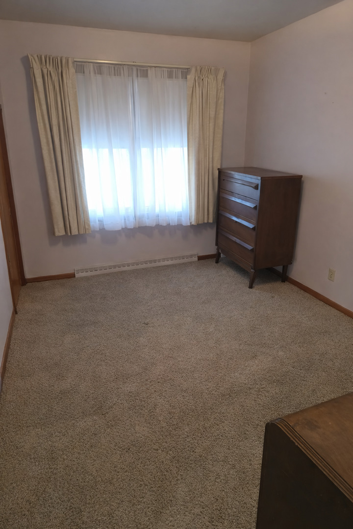 3522 Washington Street Lansing, IL 60438 - Photo 9 of 12 an empty room with windows