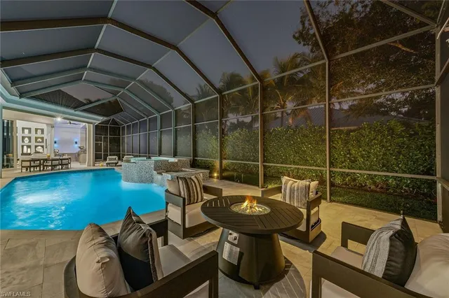 a view of a chairs and table in a patio