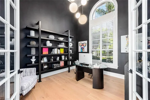 a view of a livingroom with furniture and workspace