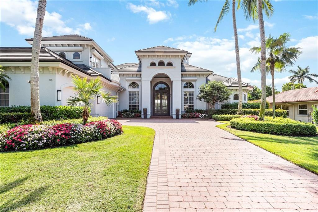 538 Riviera Drive Naples, FL 34103 - Photo 22 of 25 a view of a house with a swimming pool