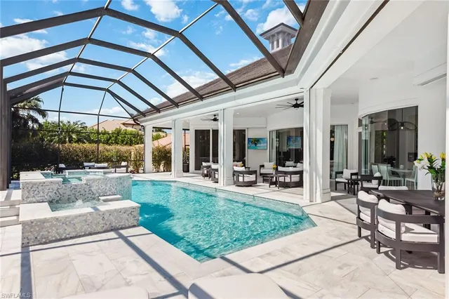 a view of a backyard with sitting area