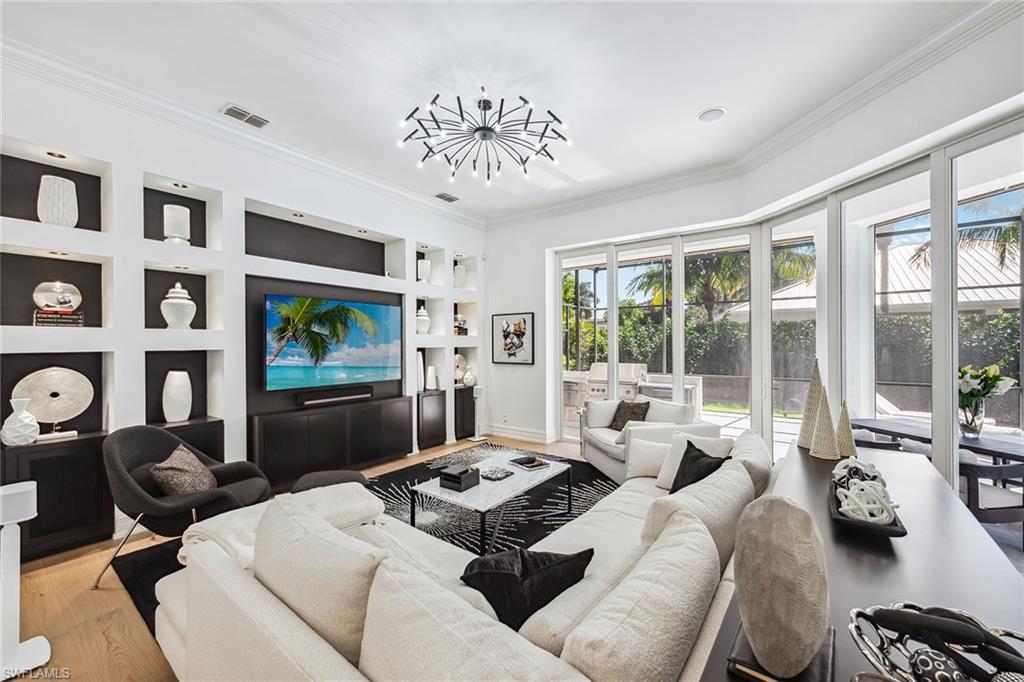 538 Riviera Drive Naples, FL 34103 - Photo 8 of 25 a living room with furniture and a large window