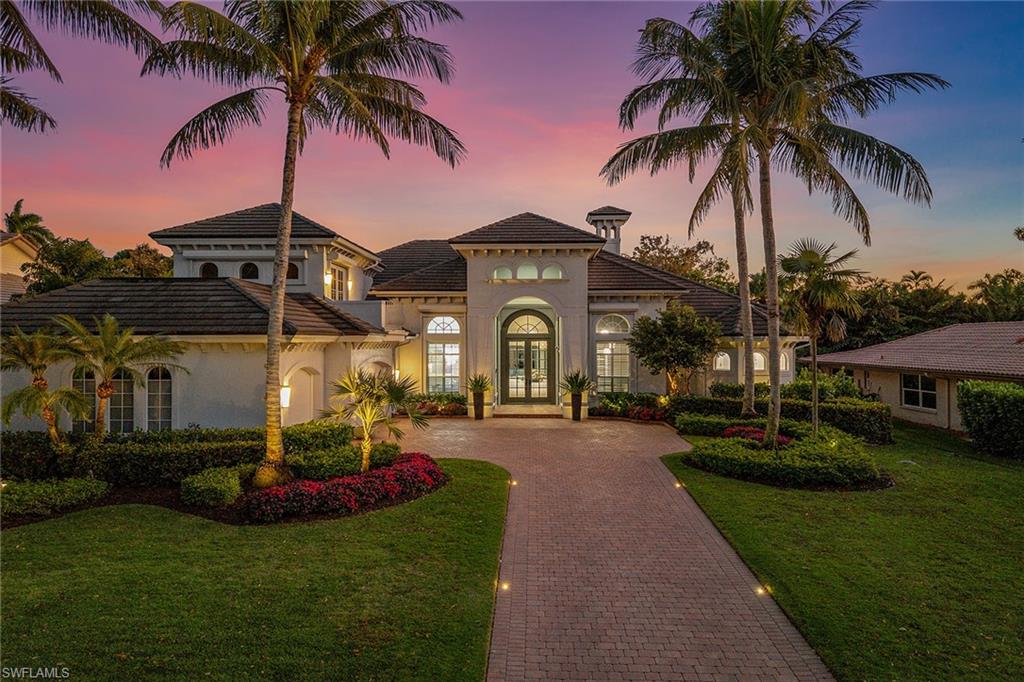538 Riviera Drive Naples, FL 34103 - Photo 10 of 25 a front view of a house with garden and porch