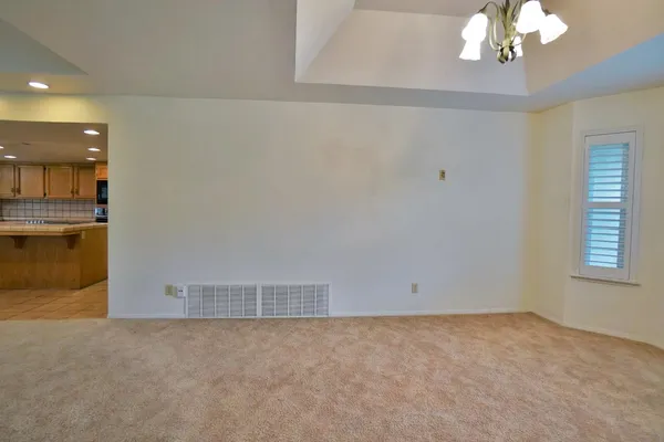 a view of an empty room with a door