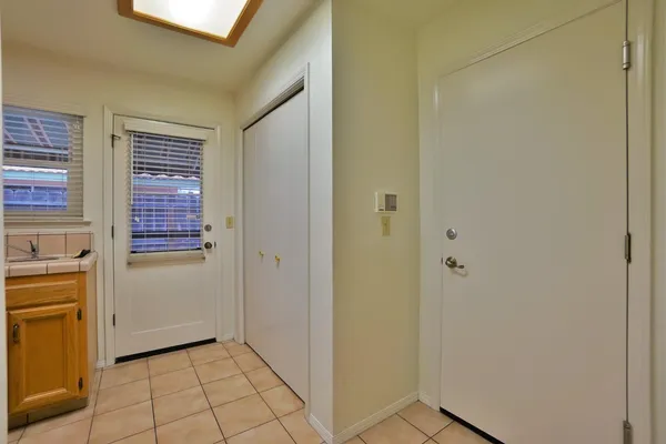 a living room with furniture large window with a rug