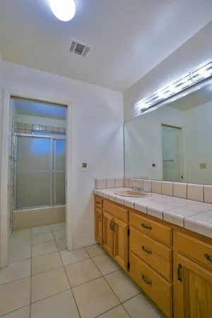 a view of a house with backyard and a garden