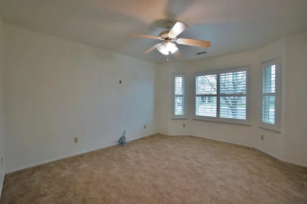 a view of house with yard and green space