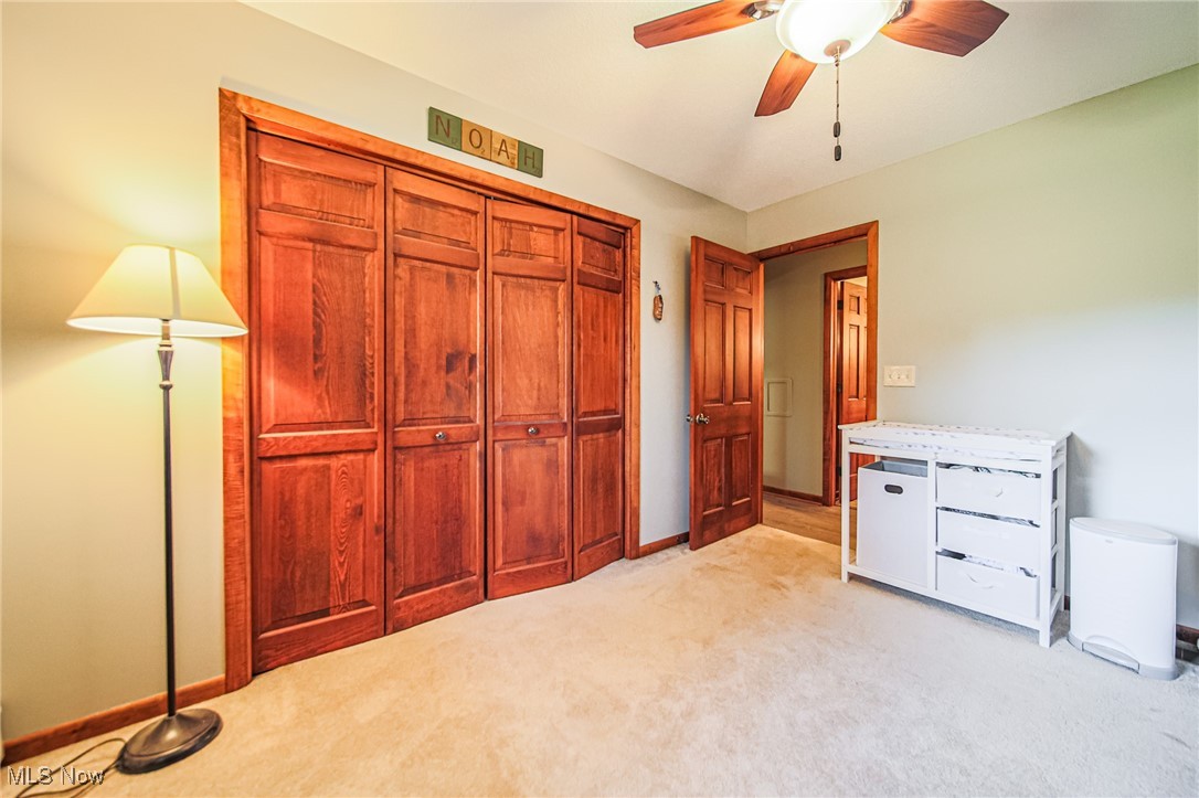 1791 Beal Road Mansfield, OH 44903 - Photo 37 of 50 Unfurnished bedroom with light carpet, a ceiling fan, and a closet