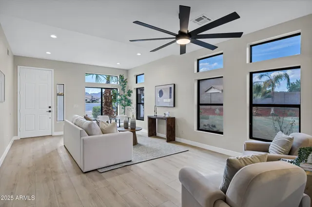 a living room with furniture and a large window