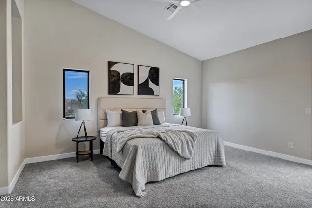 a bedroom with a bed and a window