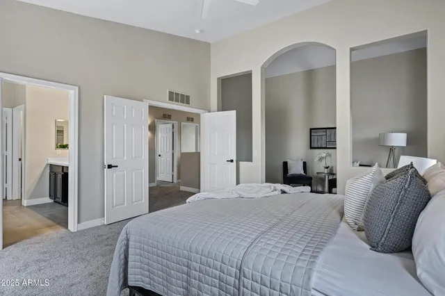 a bedroom with bed and window