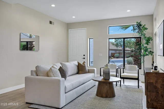a living room with furniture and a large window