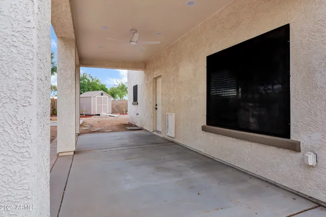 a view of a hallway with a living room