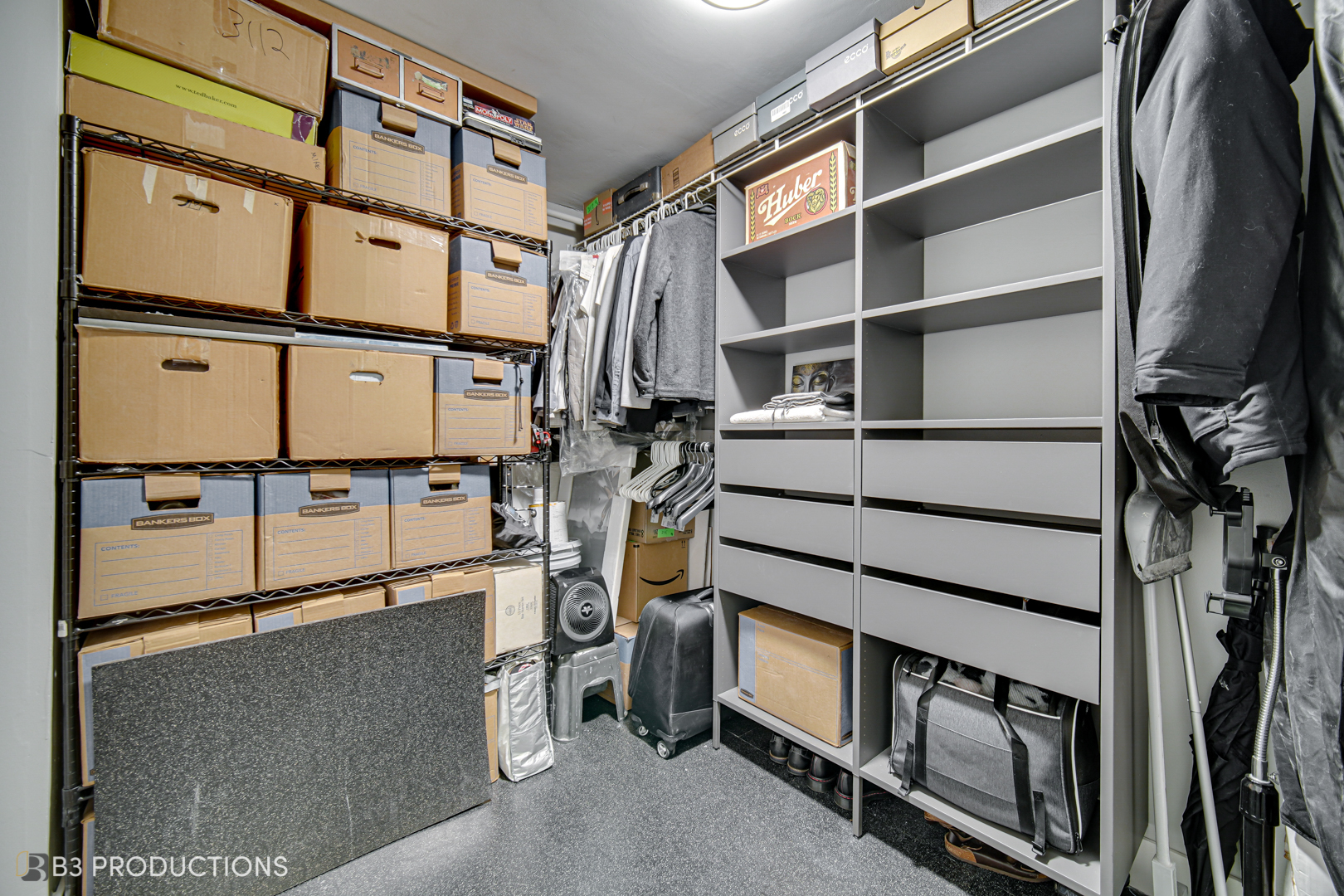 111 West Maple Street, Unit 3112 Chicago, IL 60610 - Photo 11 of 18 a view of walk in closet with clothes and shoes