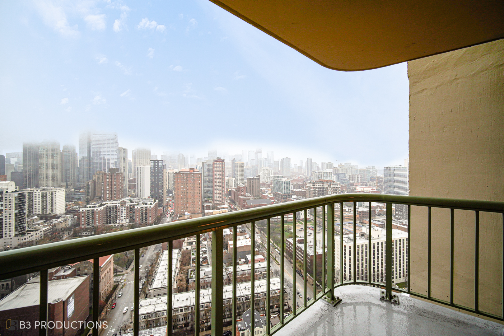 111 West Maple Street, Unit 3112 Chicago, IL 60610 - Photo 3 of 18 a view of city from a balcony