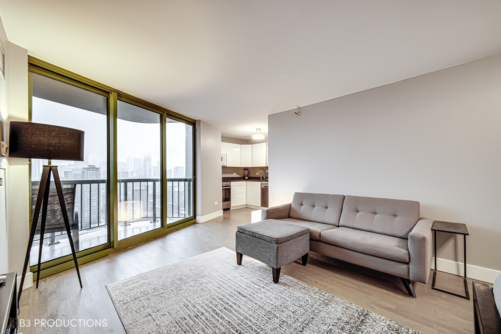 111 West Maple Street, Unit 3112 Chicago, IL 60610 - Photo 4 of 18 a living room with furniture and a flat screen tv