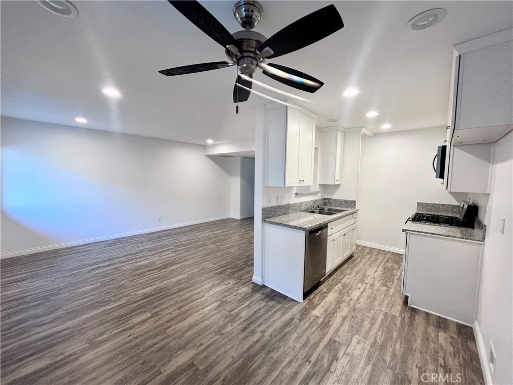 657 Scott Place, Unit 2 Glendora, CA 91740 - Photo 4 of 8 a kitchen with kitchen island a stove a sink and a refrigerator