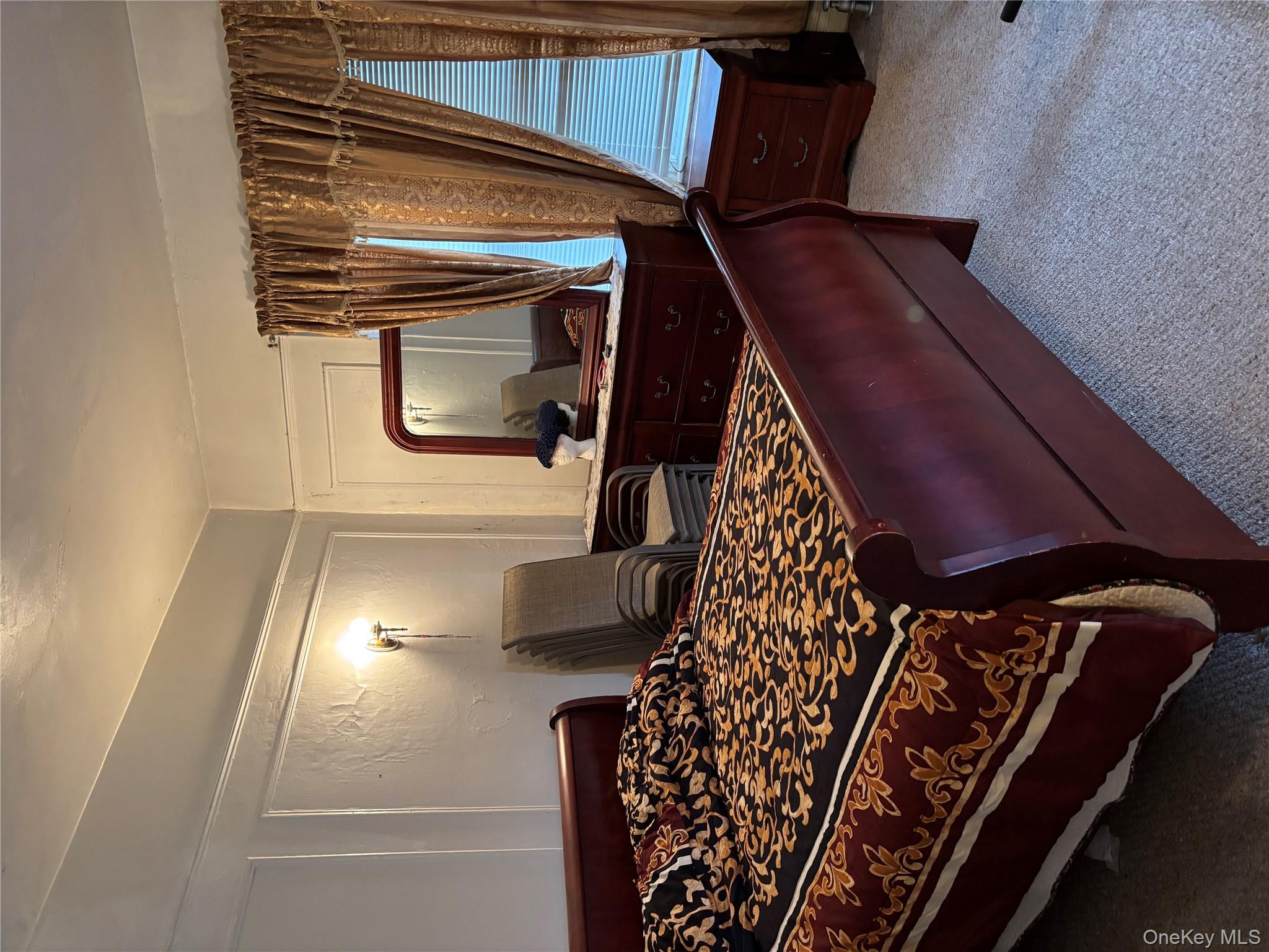 715 Rosedale Avenue Bronx, NY 10473 - Photo 11 of 11 a bed sitting in a room next to a window