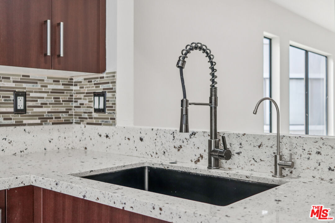 25885 Trabuco Road, Unit 226 Lake Forest, CA 92630 - Photo 15 of 23 a bathroom with a sink and a mirror
