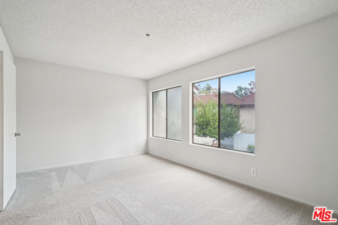 25885 Trabuco Road, Unit 226 Lake Forest, CA 92630 - Photo 20 of 23 a view of an empty room with a window