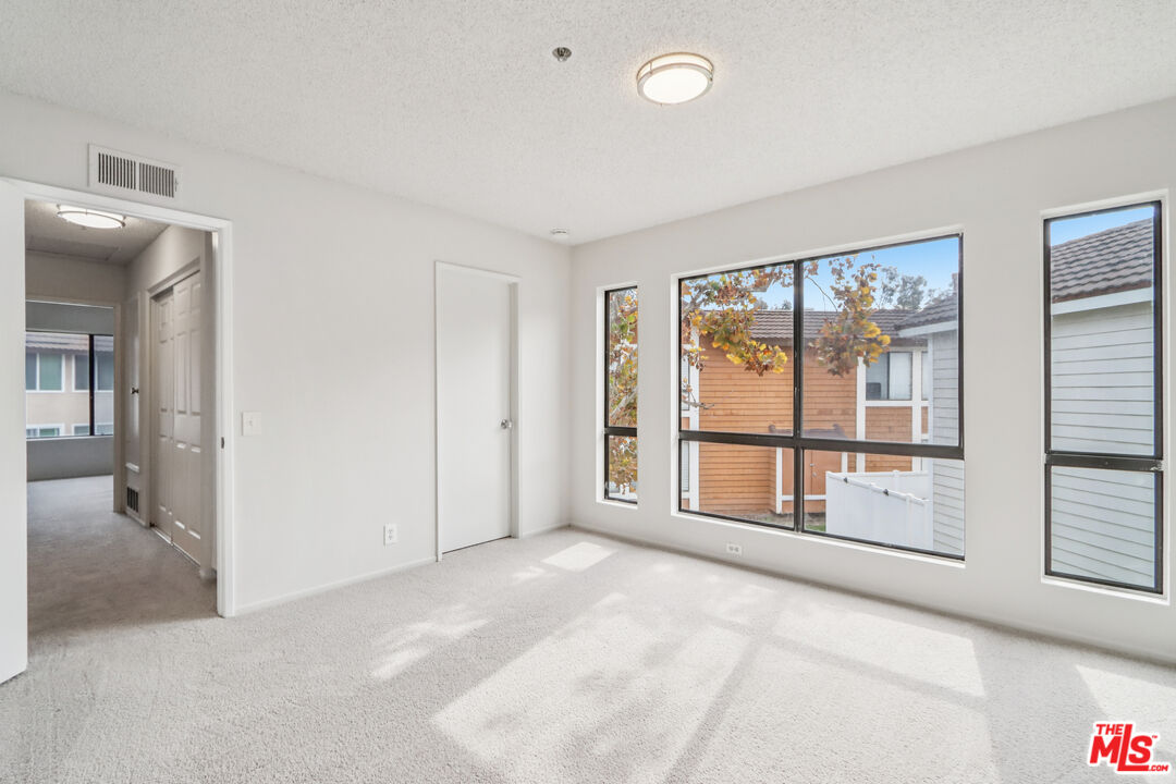 25885 Trabuco Road, Unit 226 Lake Forest, CA 92630 - Photo 21 of 23 a view of an empty room with a window