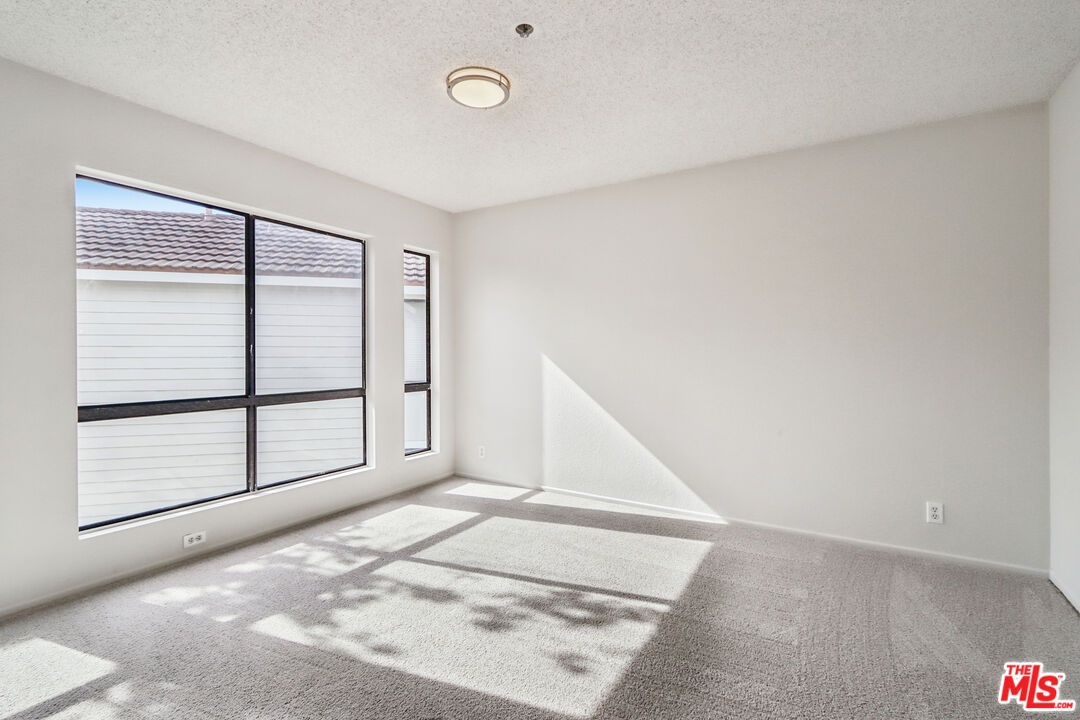 25885 Trabuco Road, Unit 226 Lake Forest, CA 92630 - Photo 3 of 23 an empty room with windows