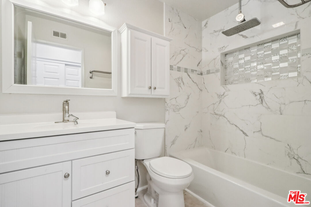 25885 Trabuco Road, Unit 226 Lake Forest, CA 92630 - Photo 5 of 23 a bathroom with a sink a toilet and bathtub