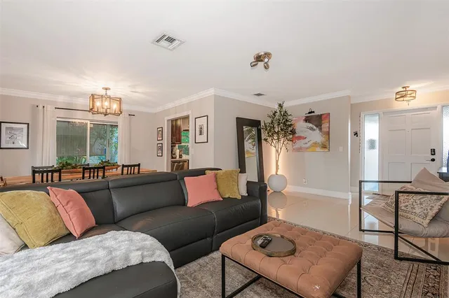 a living room with furniture and a couch