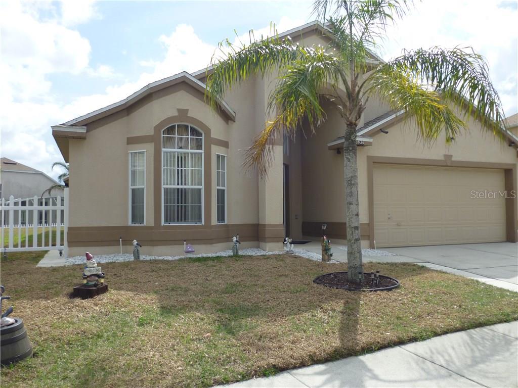 836 Riggs Circle Davenport, FL 33897 - Photo 1 of 1 a front view of a house with a yard