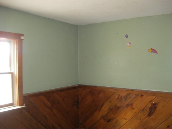 8 Stevens Way Rutland, MA 01543 - Photo 4 of 6 an empty room with wooden floor and windows