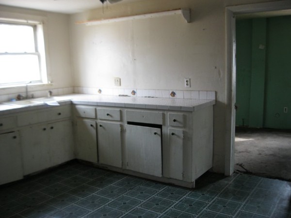 8 Stevens Way Rutland, MA 01543 - Photo 5 of 6 a utility room with a sink a window and cabinets