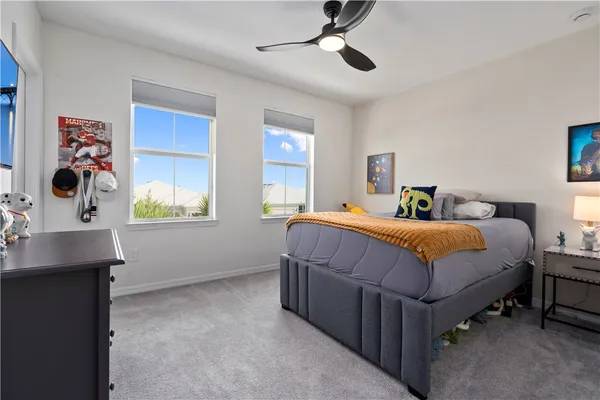 a bedroom with a large bed and a window