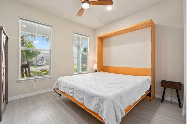 a bedroom with a bed and a window