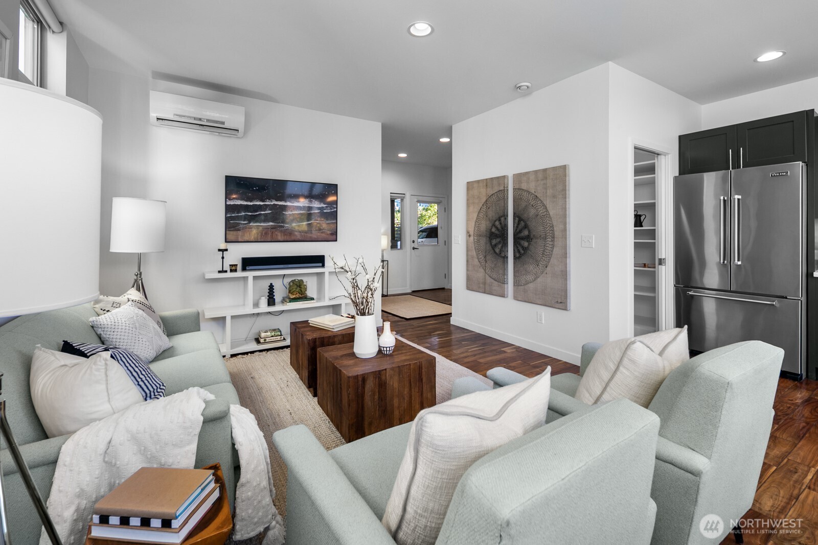 2808 14th Avenue West, Unit B Seattle, WA 98119 - Photo 9 of 39 a living room with furniture ceiling fan and a window