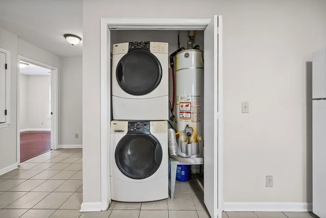 a view of a hallway with washer and dryer