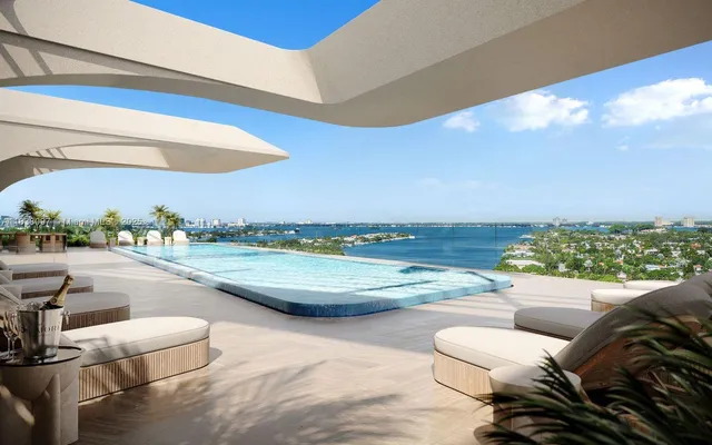 a view of a swimming pool and a back yard