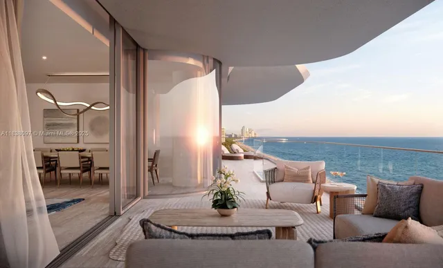 a living room with furniture and a floor to ceiling window