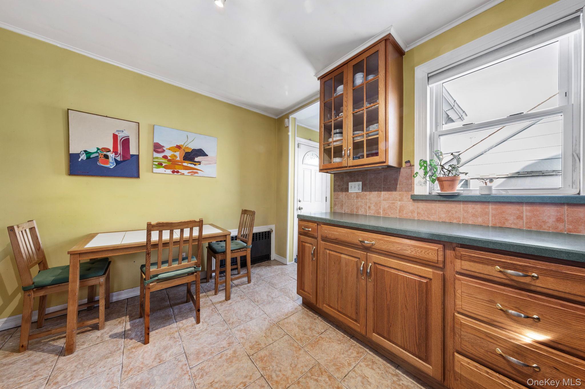 92-69 220th Street Queens, NY 11428 - Photo 12 of 33 a view of a kitchen with furniture and window