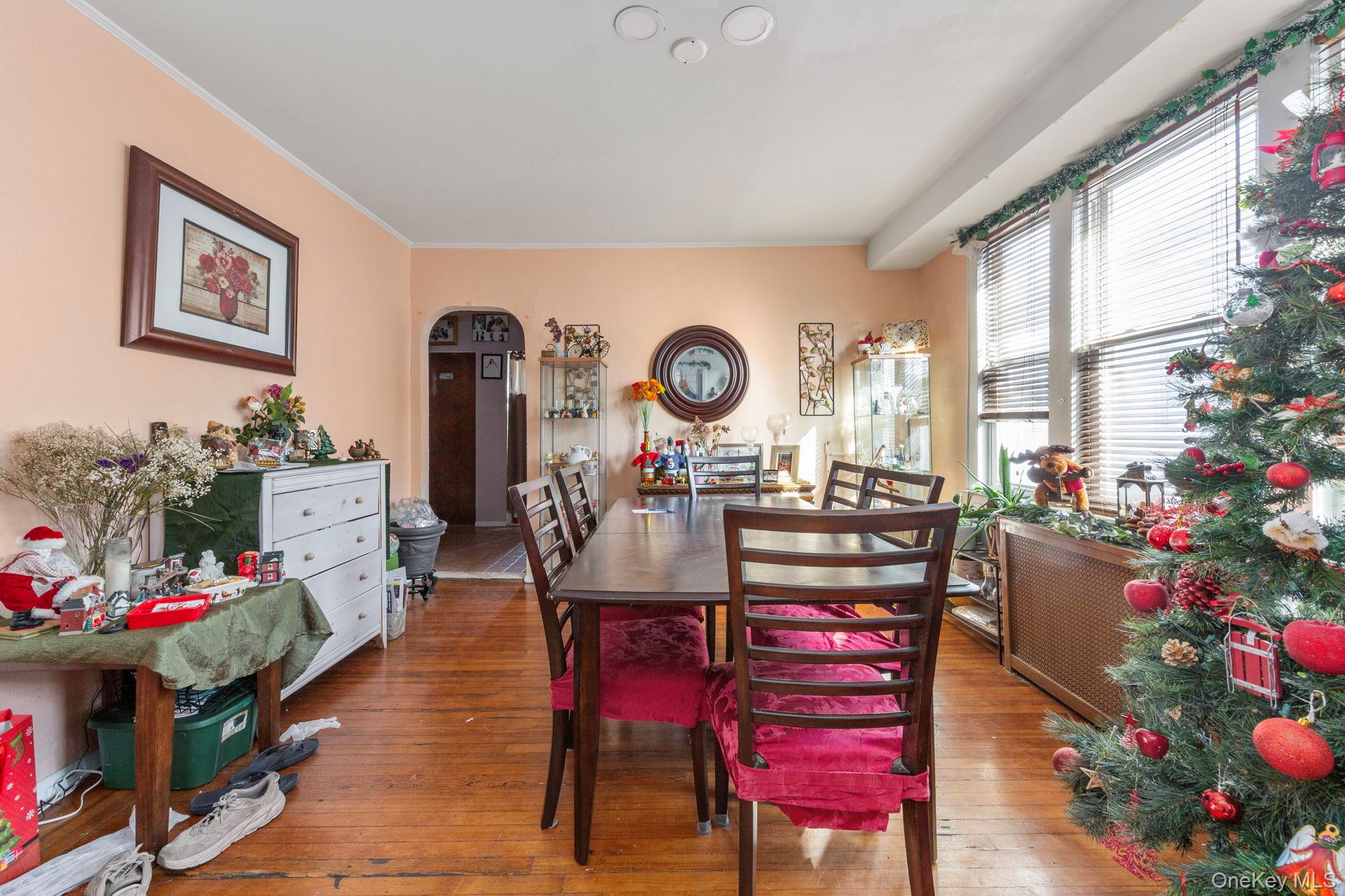 92-69 220th Street Queens, NY 11428 - Photo 15 of 33 a view of a dining room with furniture and a chandelier