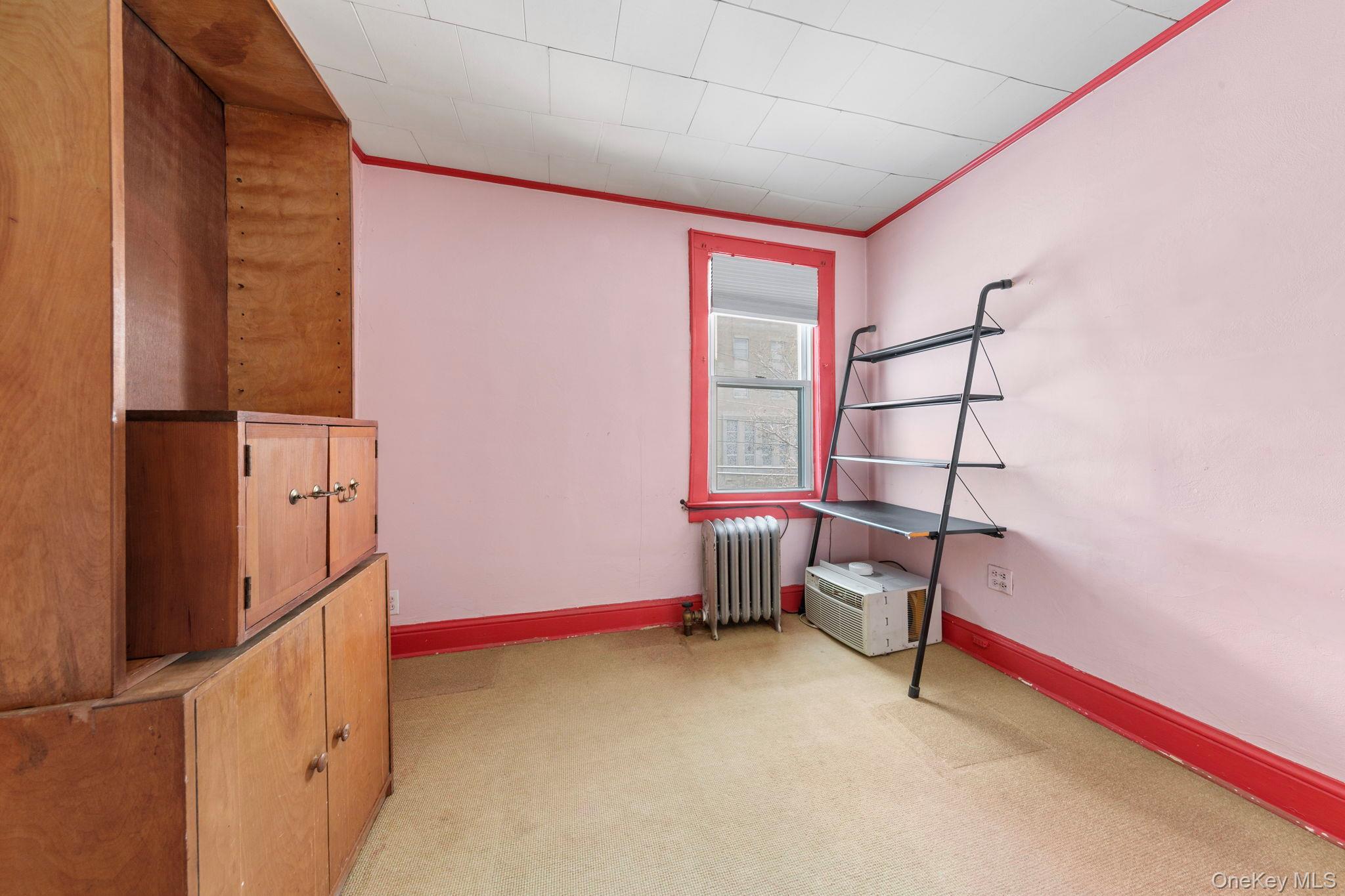 92-69 220th Street Queens, NY 11428 - Photo 19 of 33 a view of a room with racks on the wall