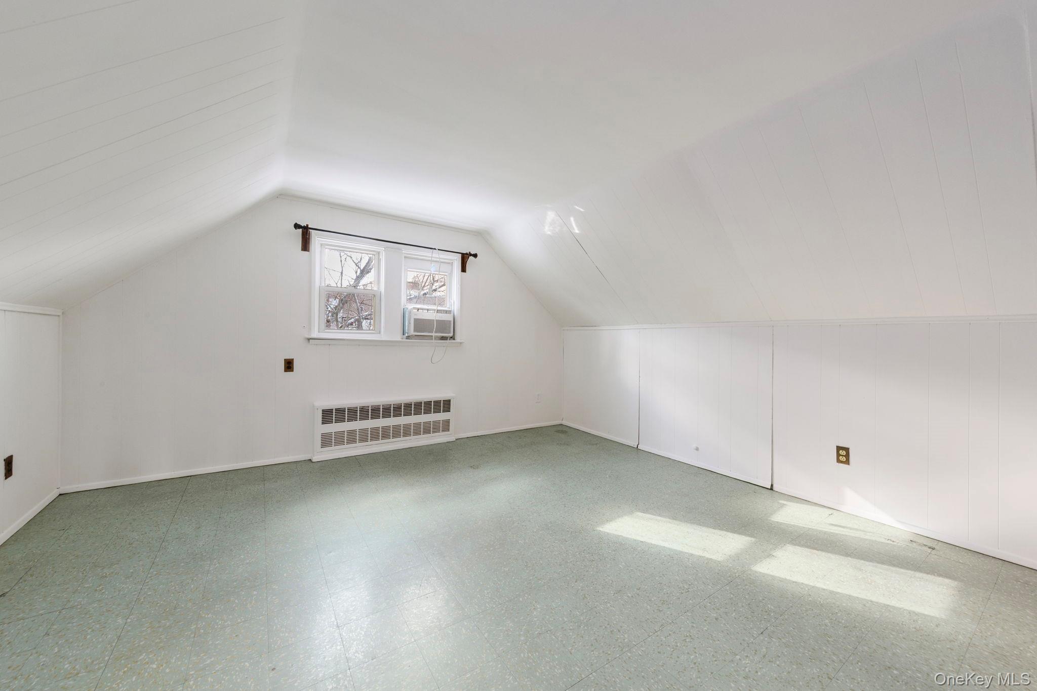 92-69 220th Street Queens, NY 11428 - Photo 20 of 33 an empty room with a window